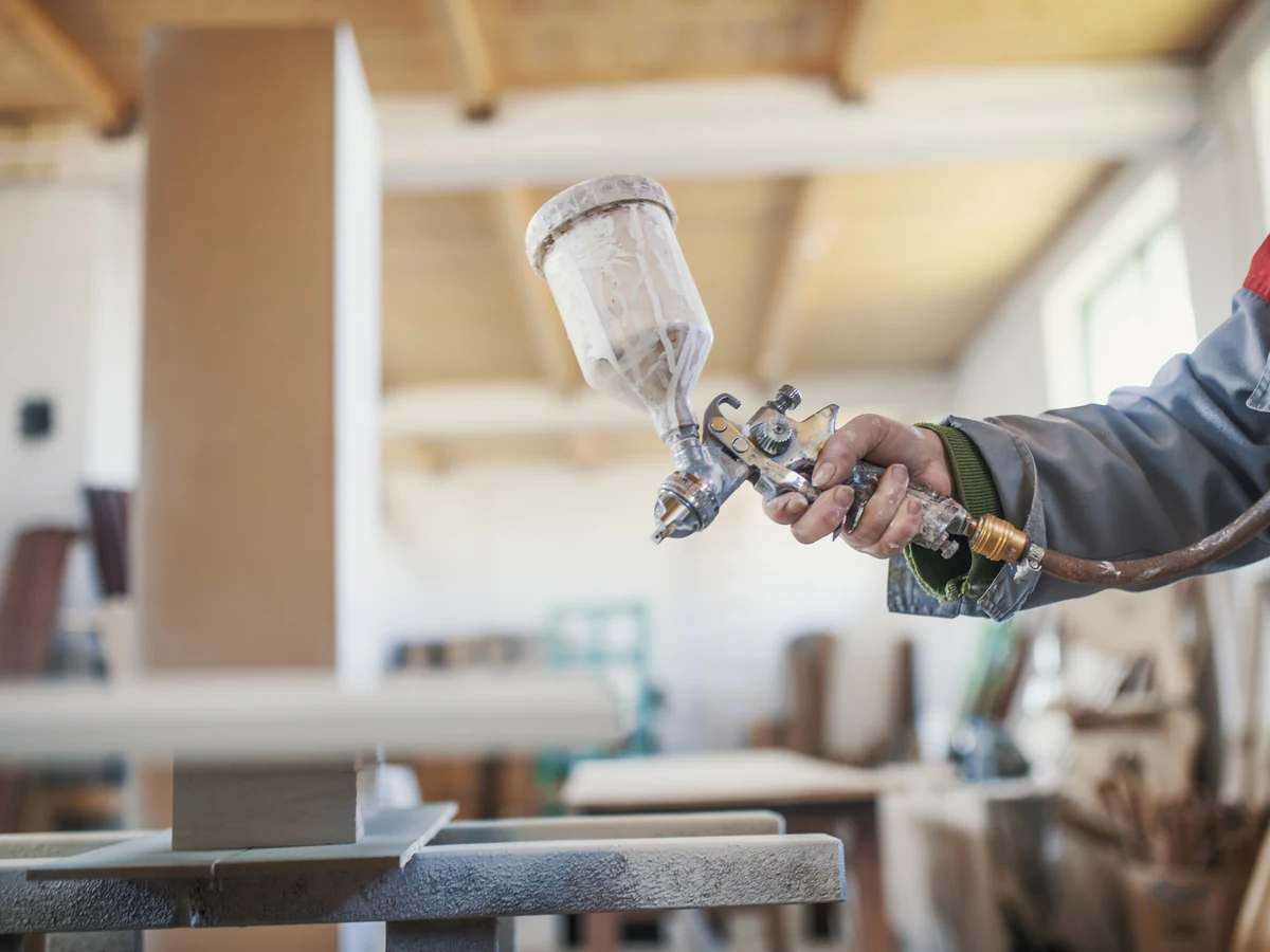 painting-decorating-worker-spray-surfaces-plymouth-painters Painting Decorating Worker Spray Surfaces by Plymouth Painters in Plymouth